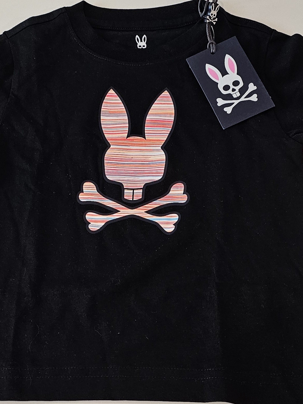 Psycho Bunny Kids Black Tee with Pink & Coral Striped Bunny Skull